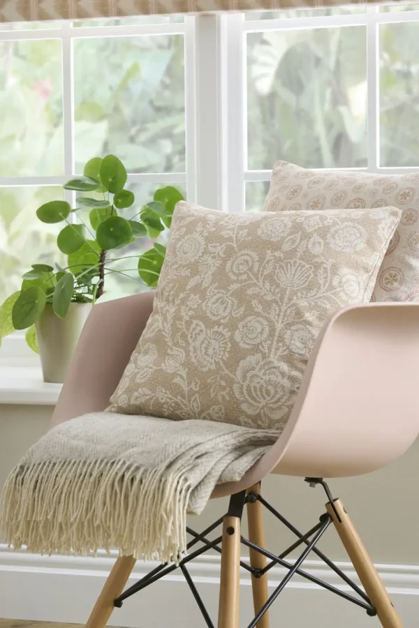 Opus Fabric - Latte by neutral botanical cushion with chair and plants