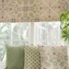 yellow botanical cushion with blind and plants