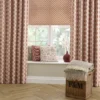 green botanical curtain with cushion and vases