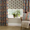 blue striped cushion with armchair and vases