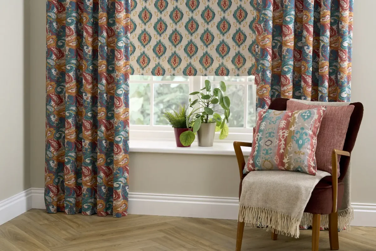 blue striped cushion with armchair and vases