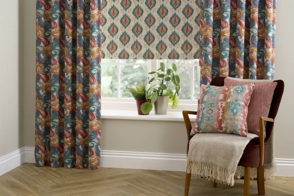 Ziba Fabric - Kingfisher by blue striped cushion with armchair and vases