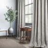 blue striped curtain with side table and plants