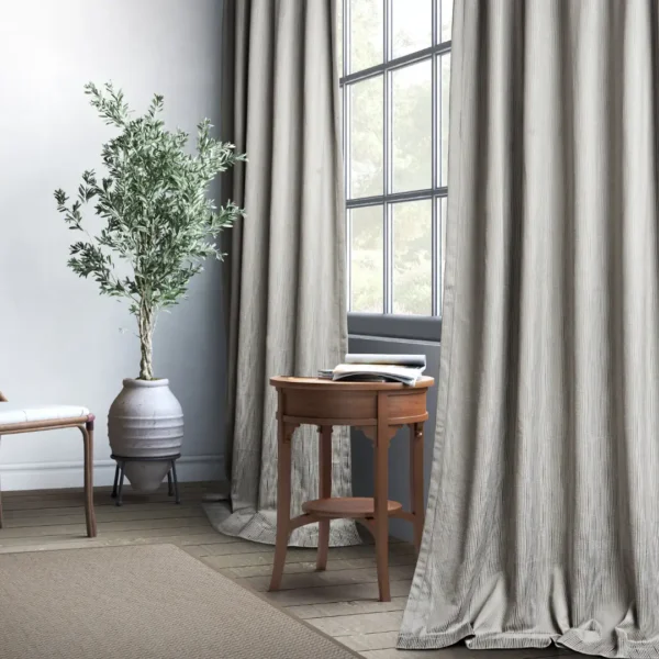 blue striped curtain with side table and plants