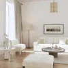 white striped pouf with sofa and armchair