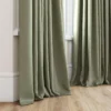 green plain curtain with window