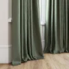 green plain curtain with window