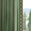 green embroidered velvet border on curtain