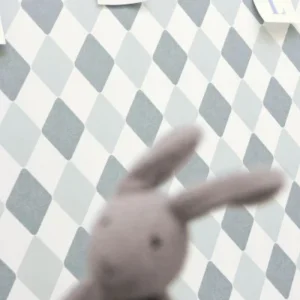 blue geometric wallpaper and wall with toys
