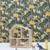 blue botanical wallpaper and wall with shelf and toys