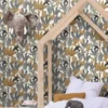 yellow botanical wallpaper and wall with cushion and toys