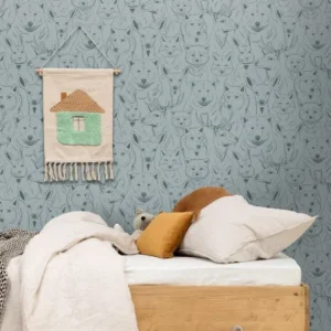 blue children's wallpaper and wall with bed and toys