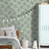 blue botanical wallpaper and wall with bed and toys