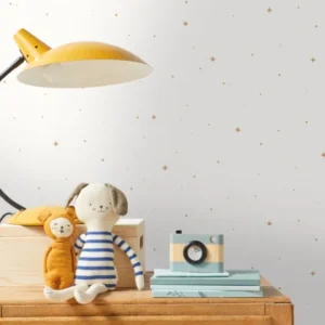 white spotted wallpaper and wall with lamps and toys