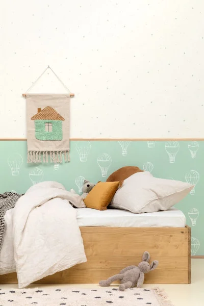 Rever Wallpaper - Menthe by white spotted wallpaper and wall with bed and cushion