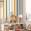 multicolour striped wallpaper and wall with cushion and lamps