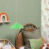 green children's wallpaper and wall with bed and cushion