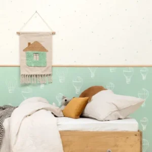 white children's wallpaper and wall with bed and toys