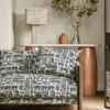 black-grey animal sofa with side table and lamps
