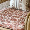 red animal armchair with cushion