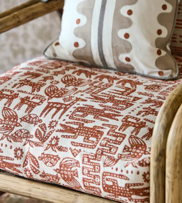 Twycross Fabric - Brick by red animal armchair with cushion
