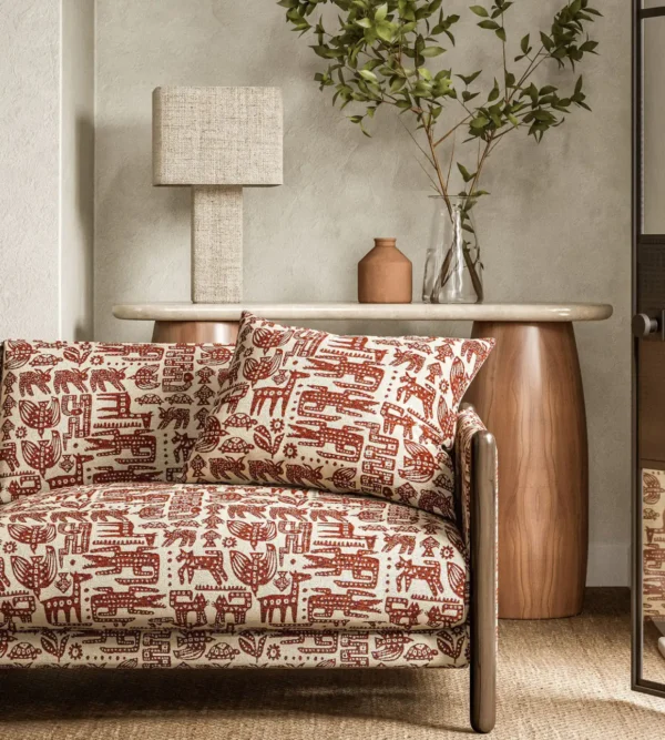 Twycross Fabric - Brick by red animal sofa with side table and lamps