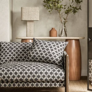 black-grey spotted sofa with side table and lamps