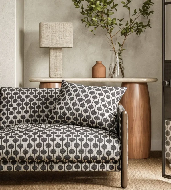 black-grey spotted sofa with side table and lamps