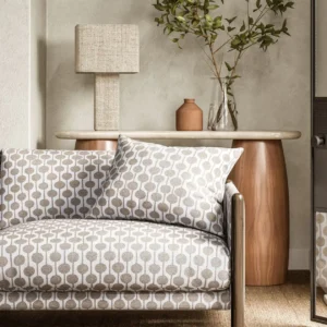neutral spotted sofa with side table and lamps