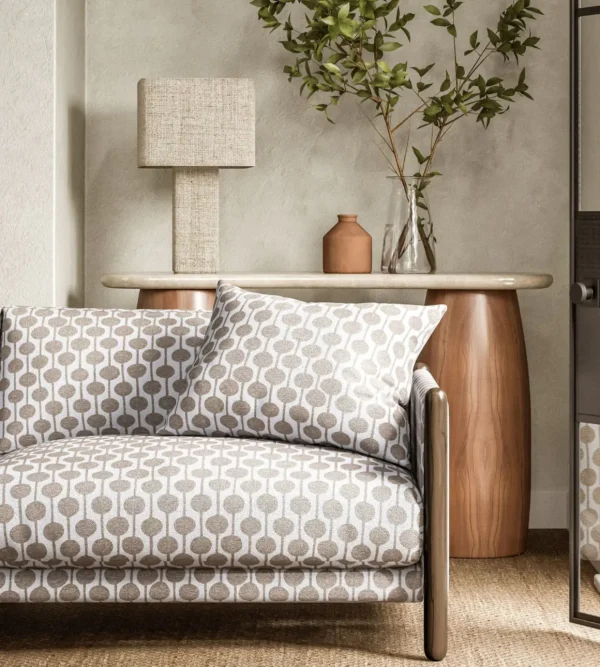 Taimi Fabric - Pebble by neutral spotted sofa with side table and lamps