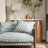 blue spotted sofa with side table and lamps