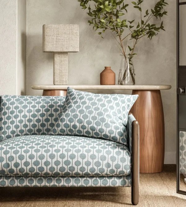 Taimi Fabric - Mist by blue spotted sofa with side table and lamps