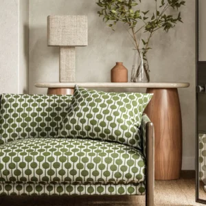 green spotted sofa with side table and lamps