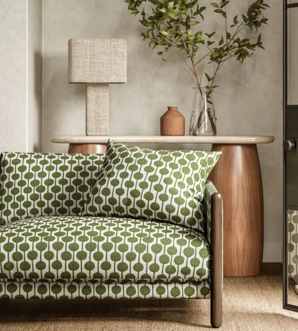 Taimi Fabric - Pine by green spotted sofa with side table and lamps
