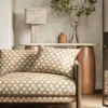 yellow spotted sofa with side table and lamps