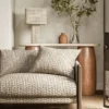neutral misc sofa with side table and lamps