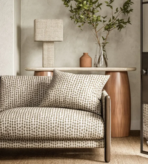 neutral misc sofa with side table and lamps