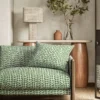 green misc sofa with side table and lamps