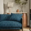 blue misc sofa with side table and lamps