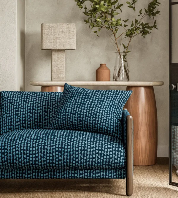 blue misc sofa with side table and lamps
