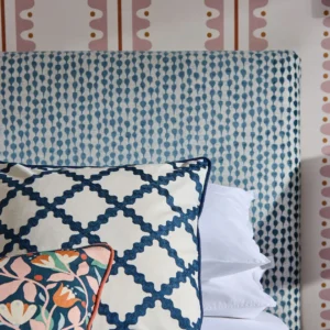 blue misc bed with cushion and wall