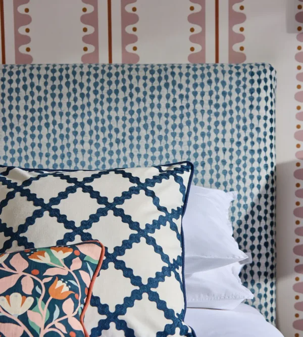 blue misc bed with cushion and wall