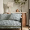 blue misc sofa with side table and lamps