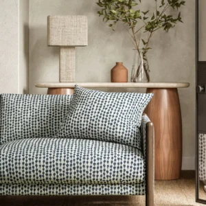 blue misc sofa with side table and lamps