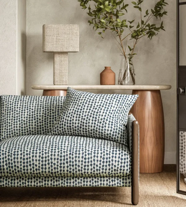 blue misc sofa with side table and lamps