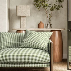 green geometric sofa with side table and lamps