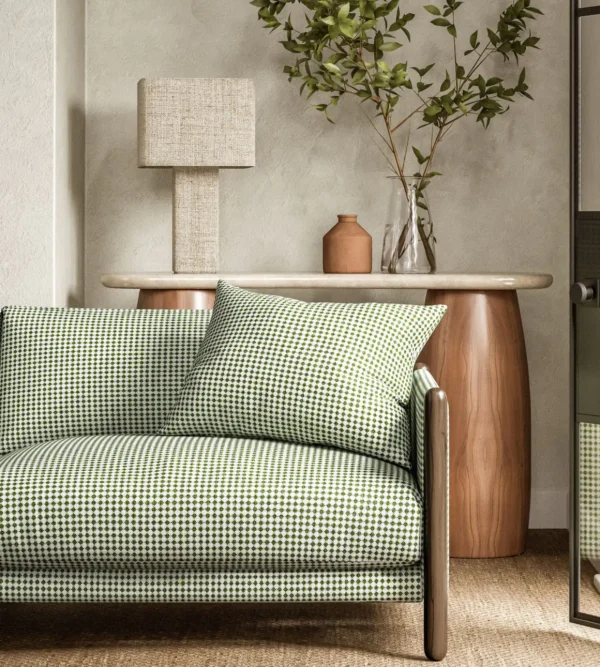 green geometric sofa with side table and lamps