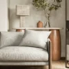 neutral geometric sofa with side table and lamps