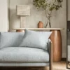 blue geometric sofa with side table and lamps