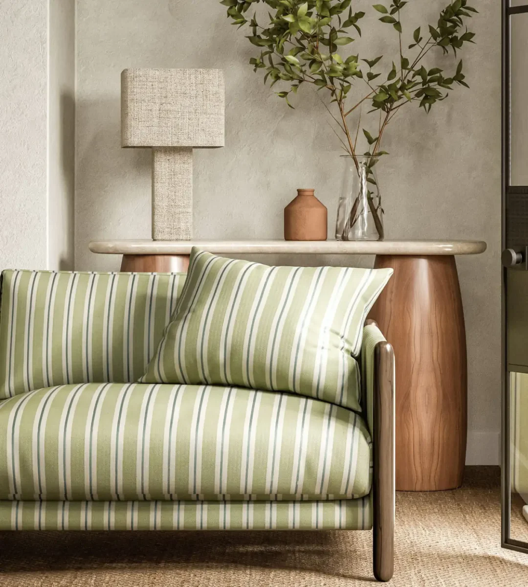 Melton Stripe Fabric - Seaglass by green striped sofa with side table and lamps